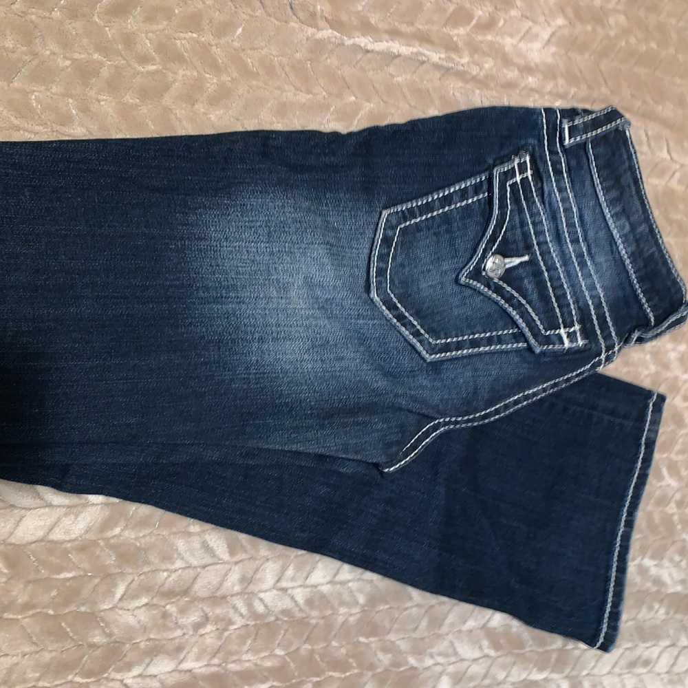 Dark wash miss me jeans.